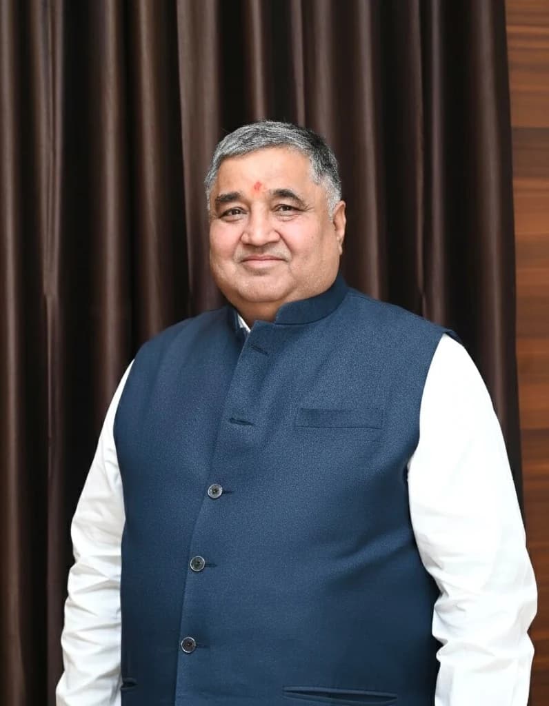 Rajesh Agrawal in a navy bandhgala jacket and white shirt