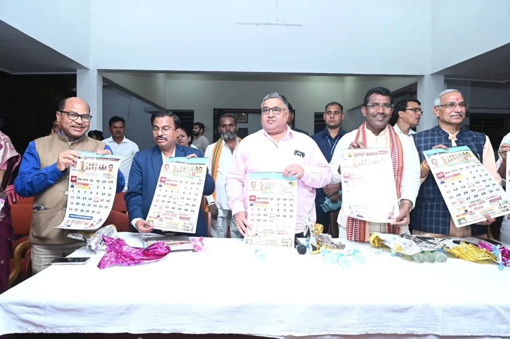 Rajesh Agrawal with others holding July 2026 calendars