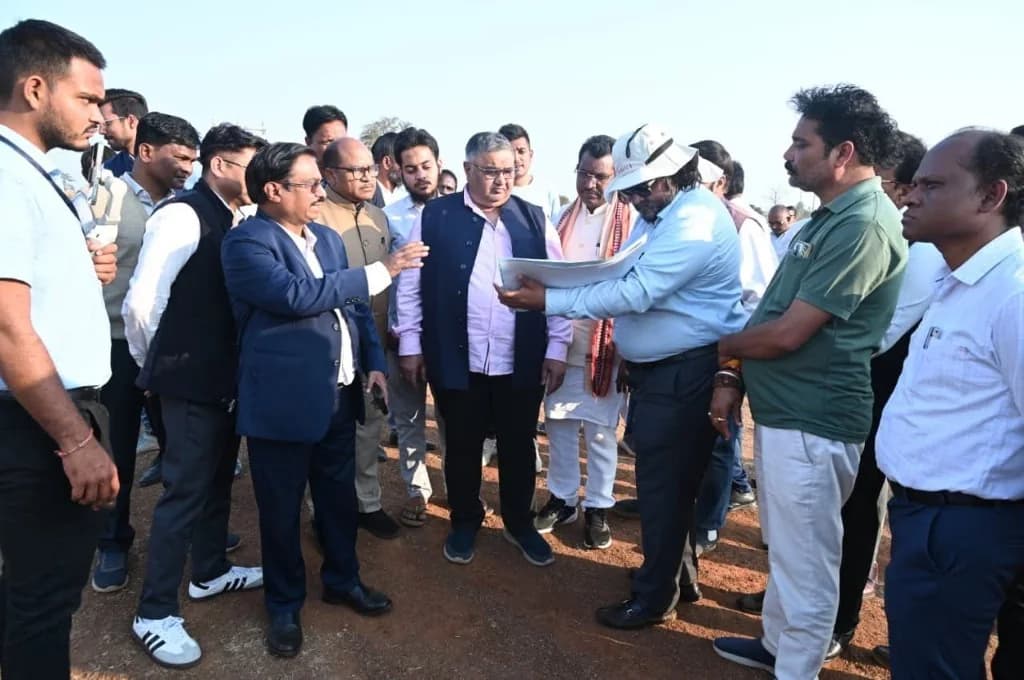 Officers showing papers to Rajesh Agrawal on the fairground