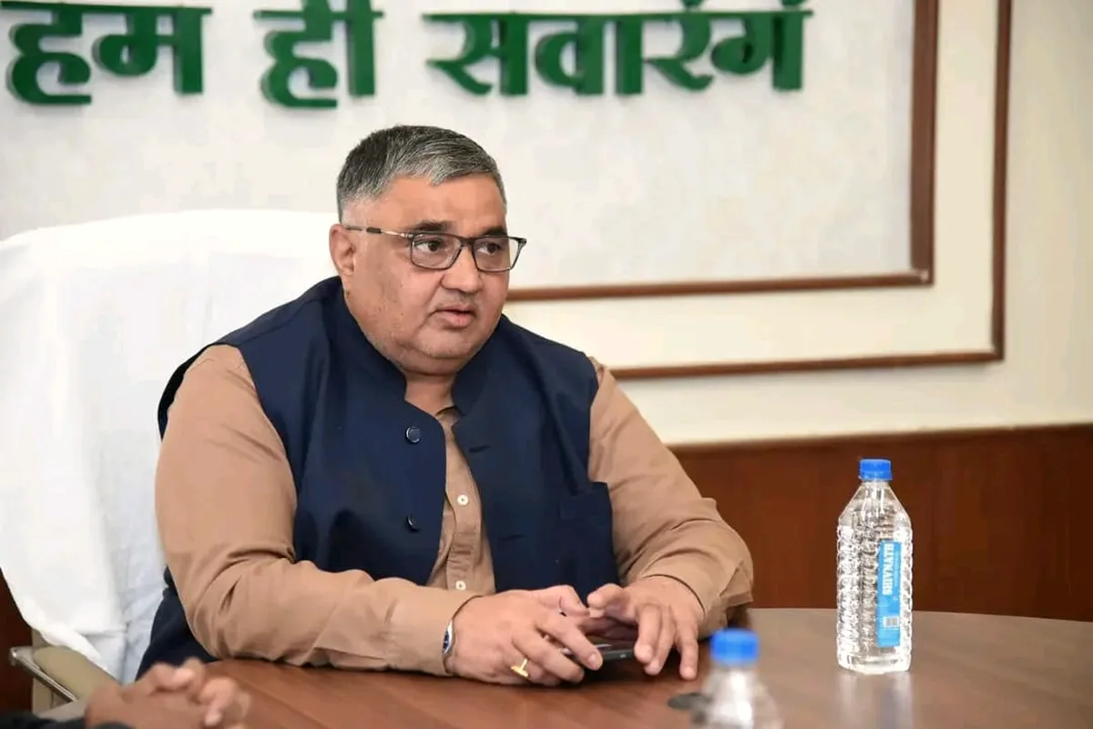Rajesh Agrawal in a navy jacket during an official meeting